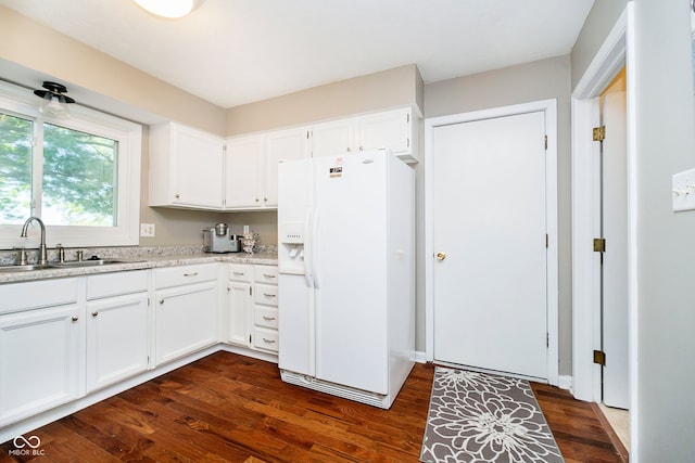 1940 Stringtown Pike, Cicero, IN 46034 - kitchen featuring white fridge with ice dispenser, light countertops, white cabinets, dark wood finished floors, and a sink