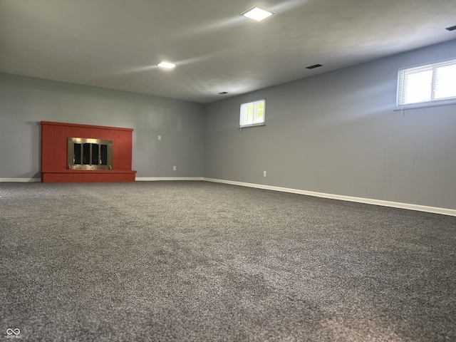 8417 S Sherman Dr, Indianapolis, IN 46237 - below grade area featuring baseboards, carpet floors, and a glass covered fireplace