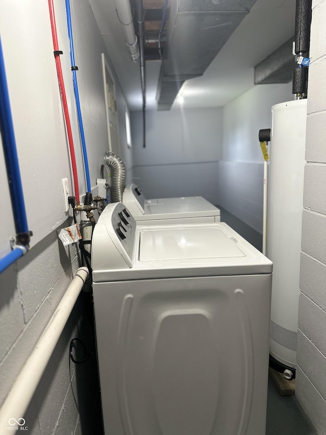 8417 S Sherman Dr, Indianapolis, IN 46237 - laundry room with washer and dryer, water heater, and concrete block wall