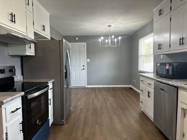 8417 S Sherman Dr, Indianapolis, IN 46237 - kitchen featuring dishwasher, electric range, black microwave, under cabinet range hood, and a chandelier