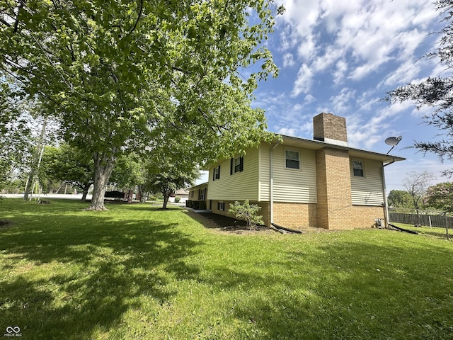 8417 S Sherman Dr, Indianapolis, IN 46237 - view of side of home featuring a chimney and brick siding