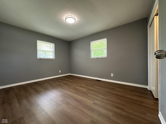 8417 S Sherman Dr, Indianapolis, IN 46237 - empty room with dark wood-style flooring and baseboards