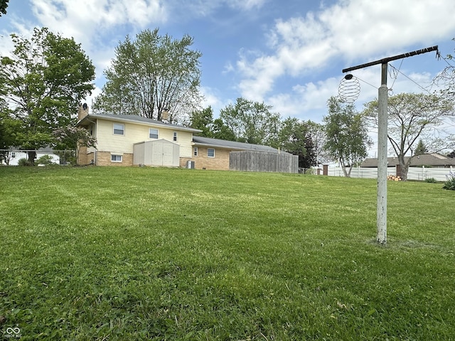 8417 S Sherman Dr, Indianapolis, IN 46237 - view of yard with a storage unit and an outbuilding