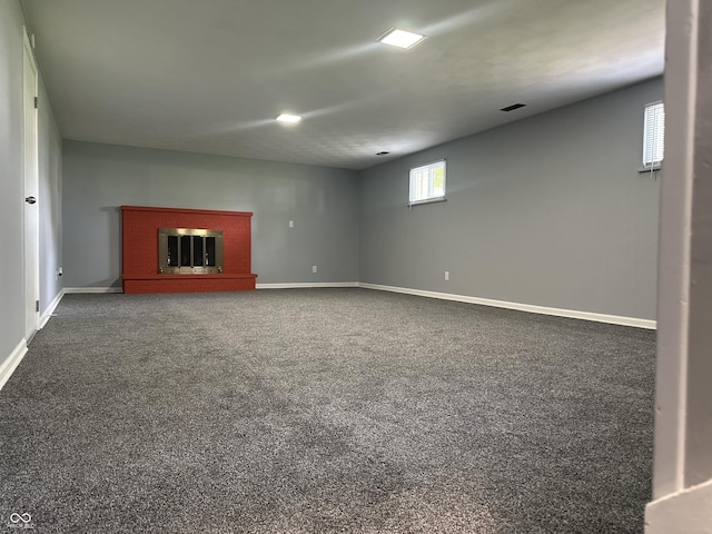 8417 S Sherman Dr, Indianapolis, IN 46237 - basement featuring baseboards, a brick fireplace, and carpet