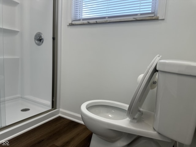 8417 S Sherman Dr, Indianapolis, IN 46237 - full bath featuring a stall shower, toilet, wood finished floors, and baseboards