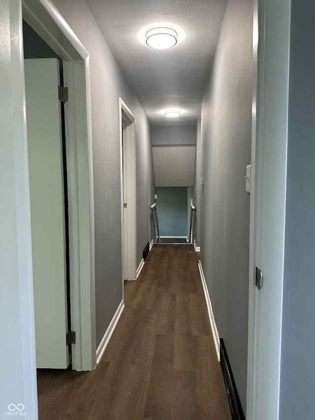 8417 S Sherman Dr, Indianapolis, IN 46237 - hallway featuring an upstairs landing, wood finished floors, and baseboards