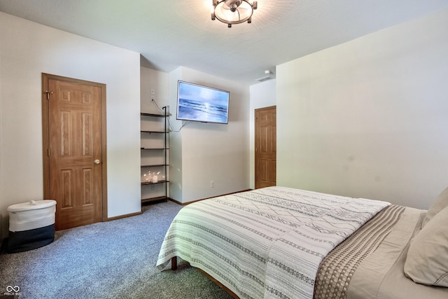 bedroom featuring carpet and baseboards
