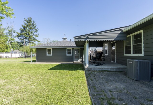 370 N Bazil Ave, Indianapolis, IN 46219 - back of property featuring central AC and a patio area
