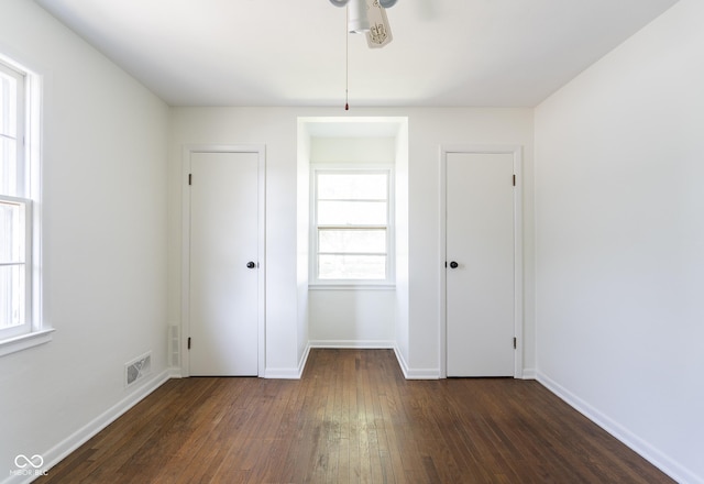 370 N Bazil Ave, Indianapolis, IN 46219 - unfurnished bedroom featuring wood-type flooring and baseboards