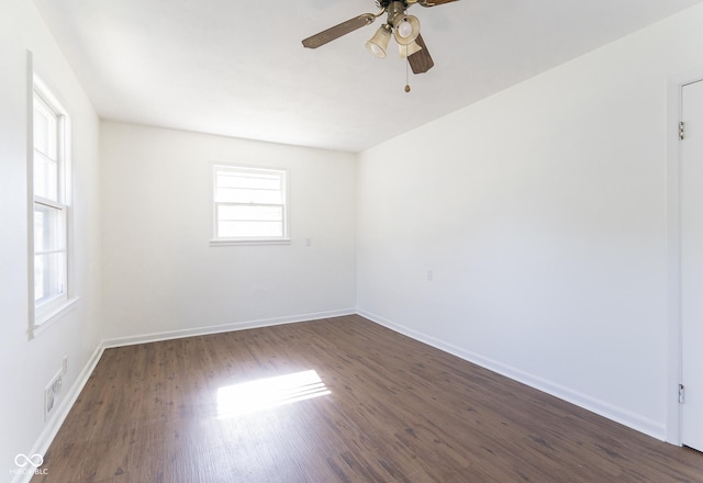 370 N Bazil Ave, Indianapolis, IN 46219 - spare room featuring a ceiling fan, dark wood-style flooring, and baseboards