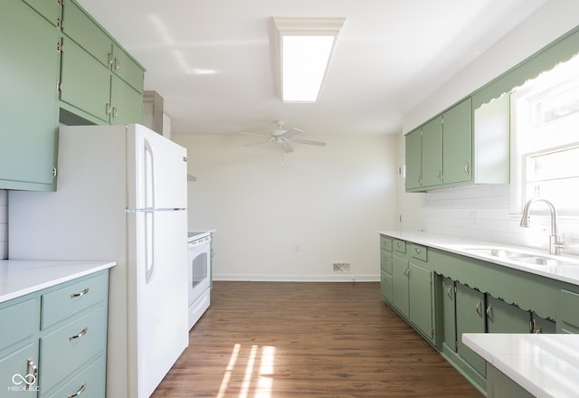 370 N Bazil Ave, Indianapolis, IN 46219 - kitchen with white appliances, a ceiling fan, a sink, light countertops, and green cabinetry
