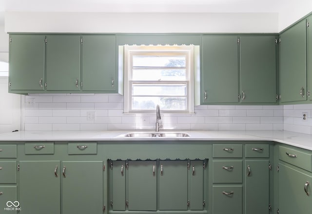 370 N Bazil Ave, Indianapolis, IN 46219 - kitchen with a sink, light countertops, and tasteful backsplash