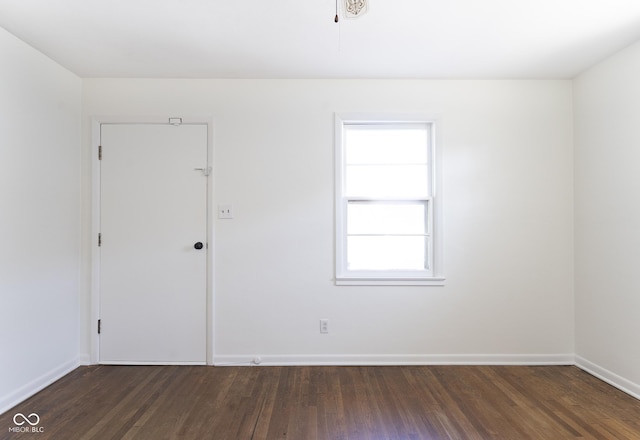 370 N Bazil Ave, Indianapolis, IN 46219 - unfurnished room featuring dark wood-type flooring and baseboards