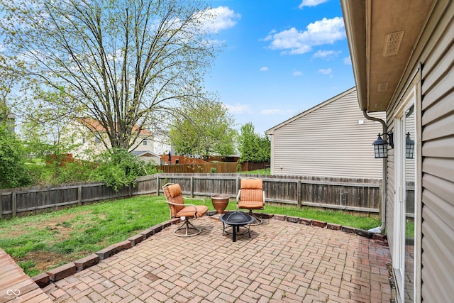 view of patio / terrace featuring an outdoor fire pit