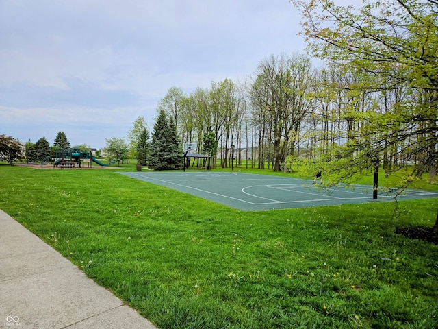 view of sport court featuring a yard and community basketball court