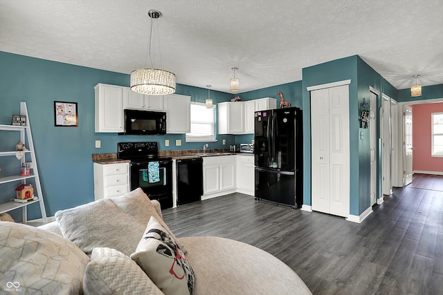 kitchen with black appliances, dark wood-style floors, white cabinets, dark countertops, and a textured ceiling
