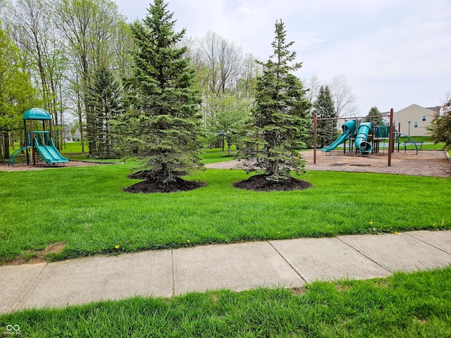 community playground featuring a lawn