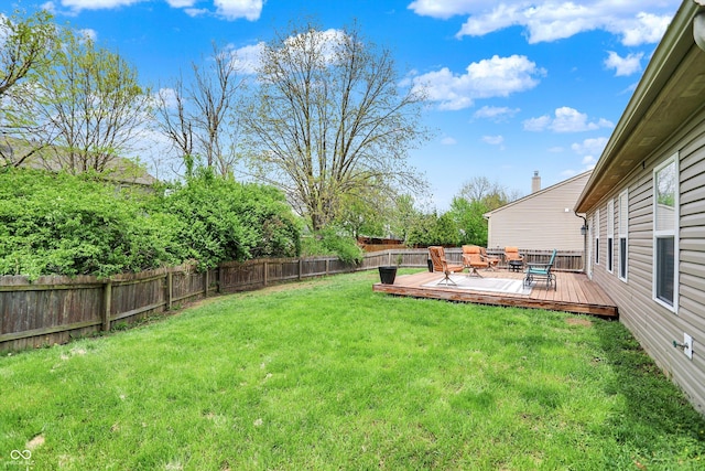 view of yard with a wooden deck