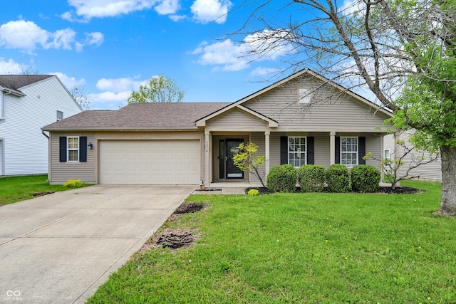 ranch-style house with an attached garage, driveway, and a front lawn