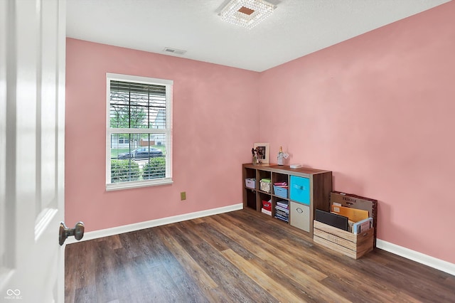 office space featuring wood finished floors and baseboards
