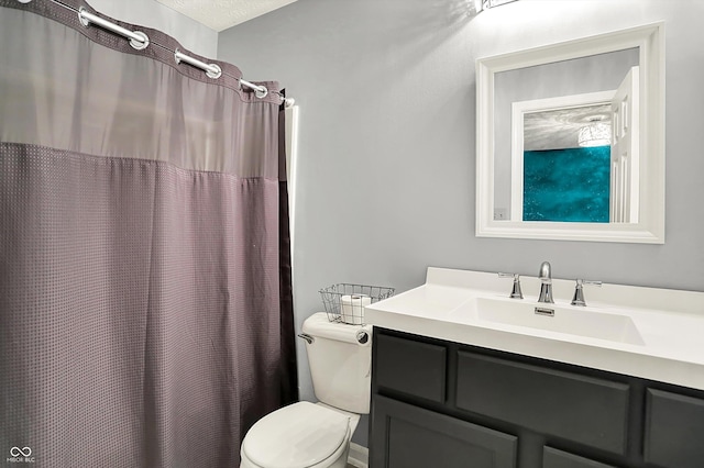 bathroom with toilet, vanity, and a shower with shower curtain