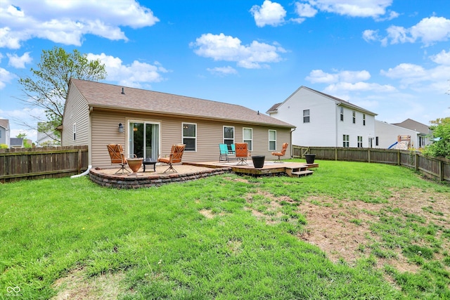 rear view of property featuring a deck