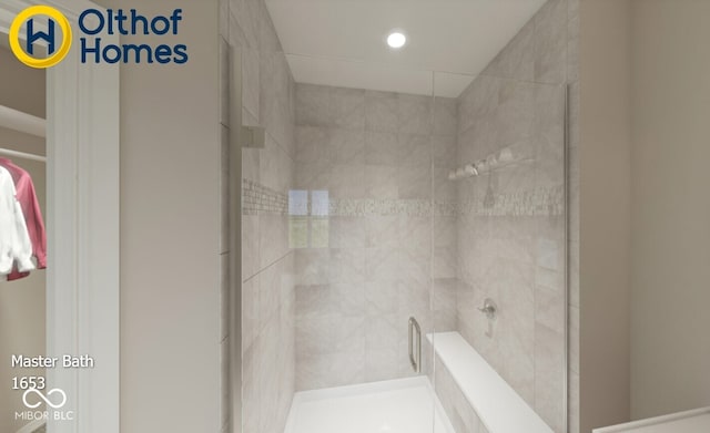 bathroom with a shower stall and recessed lighting