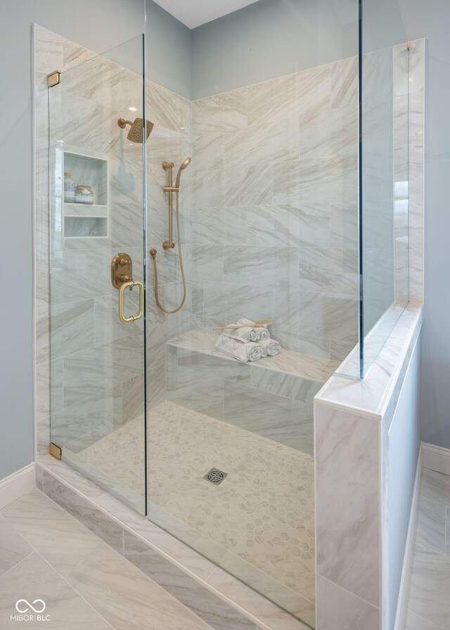 9602 Fall Creek Rd, Indianapolis, IN 46256 - full bath with a stall shower and baseboards