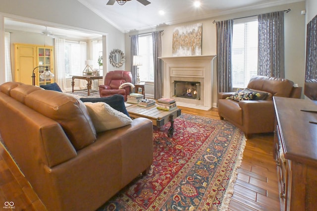 1614 Rosebud Ln Unit 83, Greenwood, IN 46143 - living room with a ceiling fan, crown molding, wood finished floors, lofted ceiling, and a fireplace with flush hearth