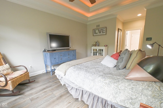 1614 Rosebud Ln Unit 83, Greenwood, IN 46143 - bedroom featuring wood finished floors, crown molding, a raised ceiling, recessed lighting, and baseboards