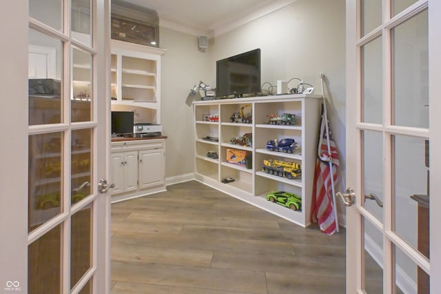 1614 Rosebud Ln Unit 83, Greenwood, IN 46143 - game room with french doors, dark wood-style floors, and ornamental molding