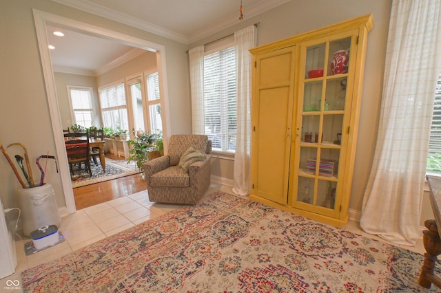 1614 Rosebud Ln Unit 83, Greenwood, IN 46143 - sitting room with tile patterned floors, crown molding, and baseboards