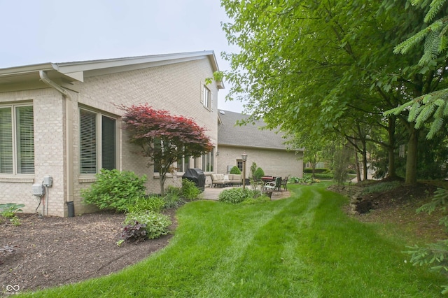 1614 Rosebud Ln Unit 83, Greenwood, IN 46143 - view of green lawn featuring a patio area and outdoor lounge area