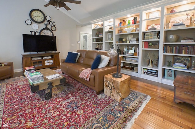 1614 Rosebud Ln Unit 83, Greenwood, IN 46143 - living room featuring vaulted ceiling, a ceiling fan, wood finished floors, and crown molding