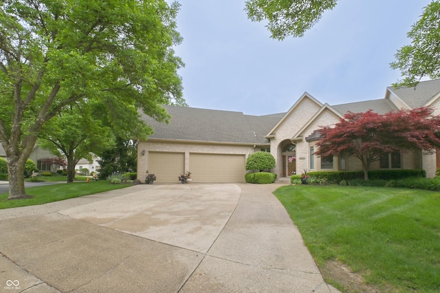 1614 Rosebud Ln Unit 83, Greenwood, IN 46143 - view of front of house with a garage, concrete driveway, and a front yard