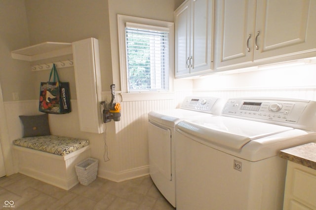 1614 Rosebud Ln Unit 83, Greenwood, IN 46143 - laundry room with cabinet space, washer and clothes dryer, and wainscoting