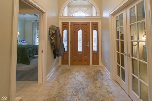 1614 Rosebud Ln Unit 83, Greenwood, IN 46143 - foyer with french doors and light tile patterned flooring