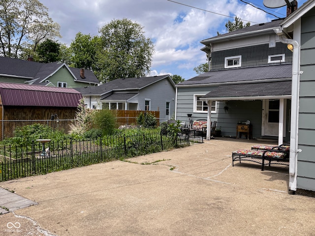 view of patio featuring fence