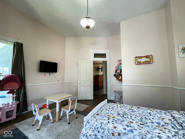 bedroom featuring baseboards and carpet floors