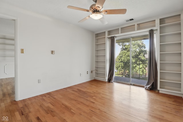 5038 Allisonville Rd Unit E, Indianapolis, IN 46205 - spare room featuring built in features, light wood-style floors, and a ceiling fan