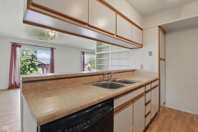 5038 Allisonville Rd Unit E, Indianapolis, IN 46205 - kitchen with black dishwasher, a sink, light wood finished floors, and healthy amount of natural light