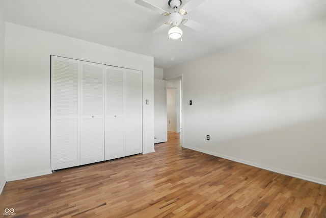 5038 Allisonville Rd Unit E, Indianapolis, IN 46205 - unfurnished bedroom featuring light wood-style floors, baseboards, a closet, and ceiling fan