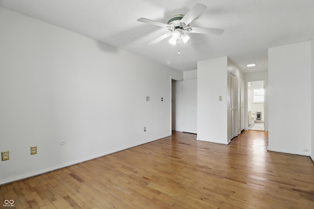 5038 Allisonville Rd Unit E, Indianapolis, IN 46205 - empty room featuring light wood-style floors, ceiling fan, and baseboards