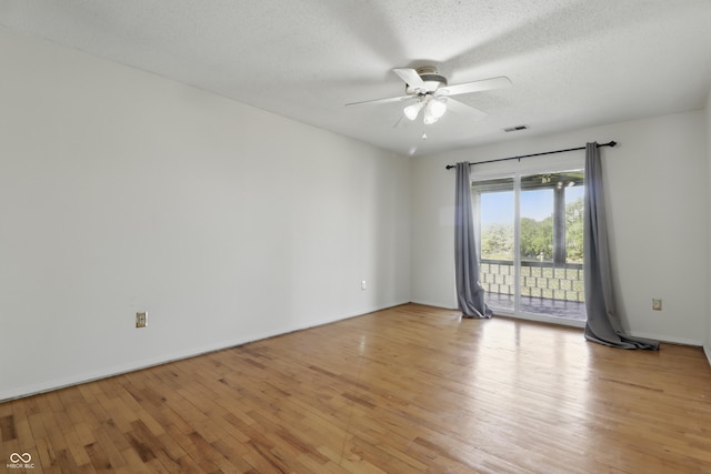 5038 Allisonville Rd Unit E, Indianapolis, IN 46205 - empty room with ceiling fan, light wood-style flooring, a textured ceiling, and baseboards
