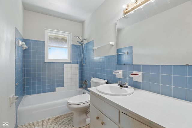 5038 Allisonville Rd Unit E, Indianapolis, IN 46205 - full bathroom featuring toilet, shower / tub combination, tile patterned floors, vanity, and tile walls