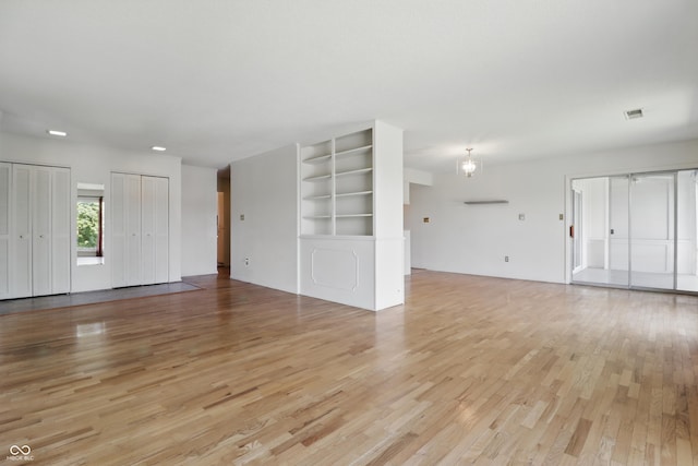 5038 Allisonville Rd Unit E, Indianapolis, IN 46205 - unfurnished living room with light wood-type flooring