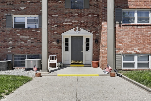 5038 Allisonville Rd Unit E, Indianapolis, IN 46205 - view of exterior entry with cooling unit and brick siding