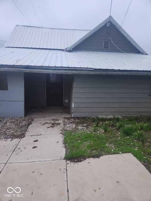 view of home's exterior with metal roof