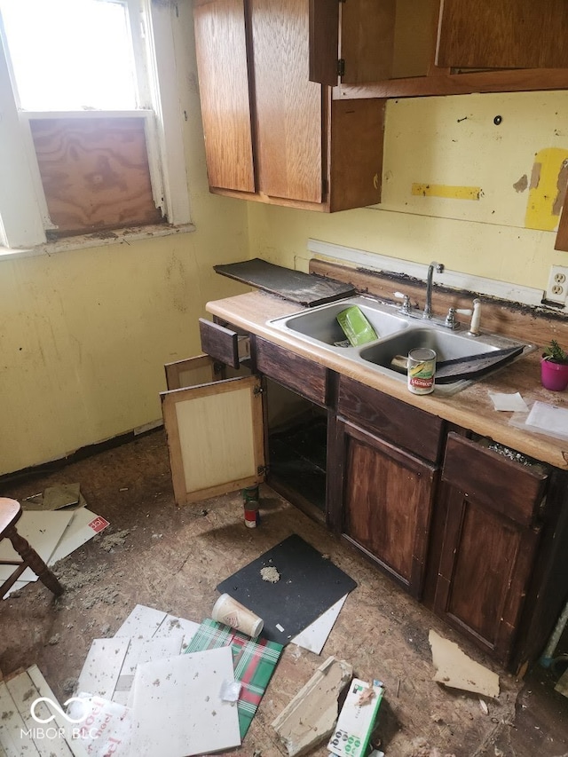 kitchen with a sink and light countertops
