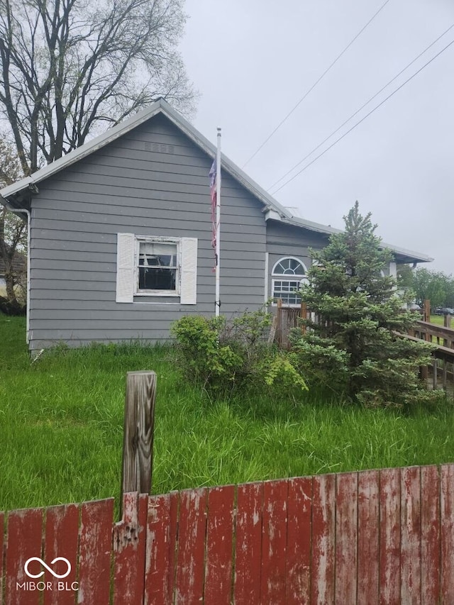 view of property exterior with fence
